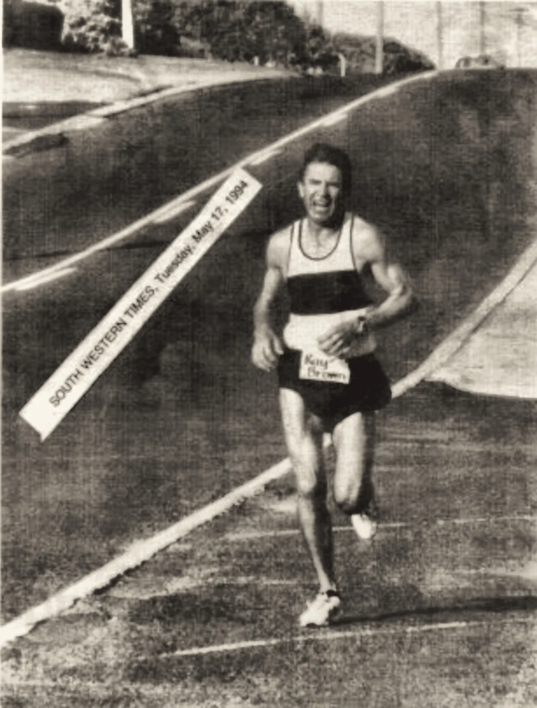 A newspaper clipping of a runner on course, dated South Western Times, Tuesday 27 May 1994.